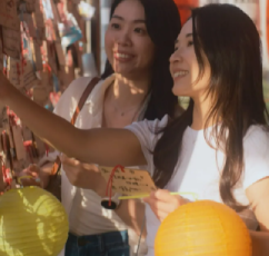 Hand writing wishes on a red lantern